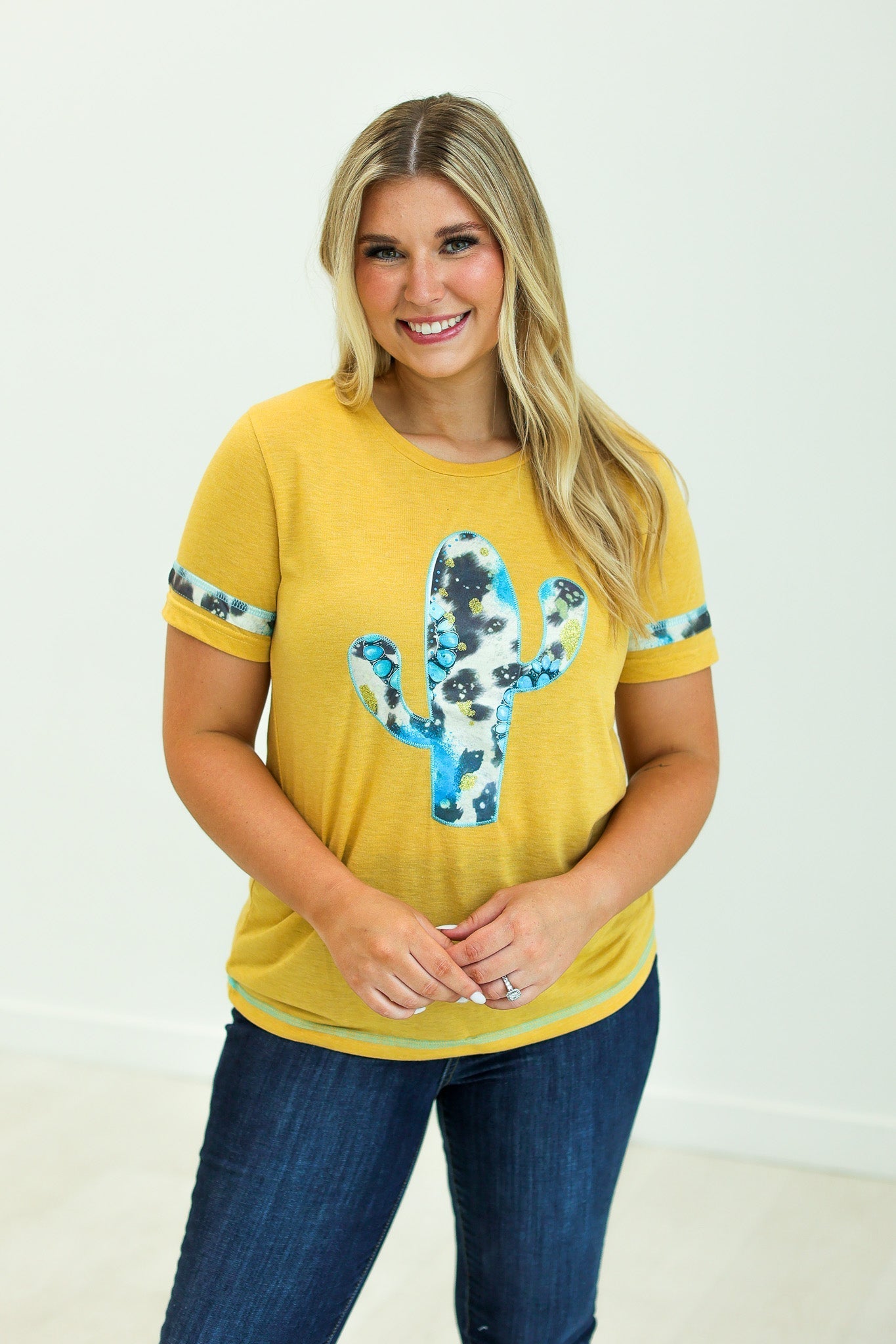 Cactus and Turquoise on Mustard Tee with Cowprint Yellow Wanderer Rotation by Southern Grace | Fleurcouture