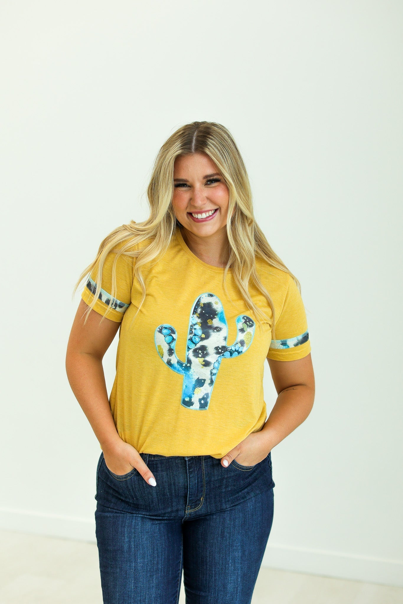 Cactus and Turquoise on Mustard Tee with Cowprint Yellow Wanderer Rotation by Southern Grace | Fleurcouture