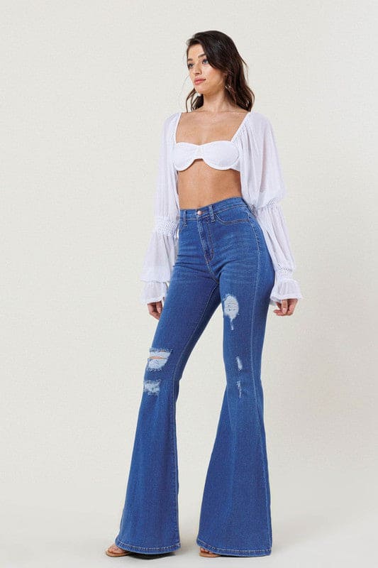 High-Rise Distressed Flare Jeans Medium Stone Flare Jeans by Vibrant M.i.U | Fleurcouture