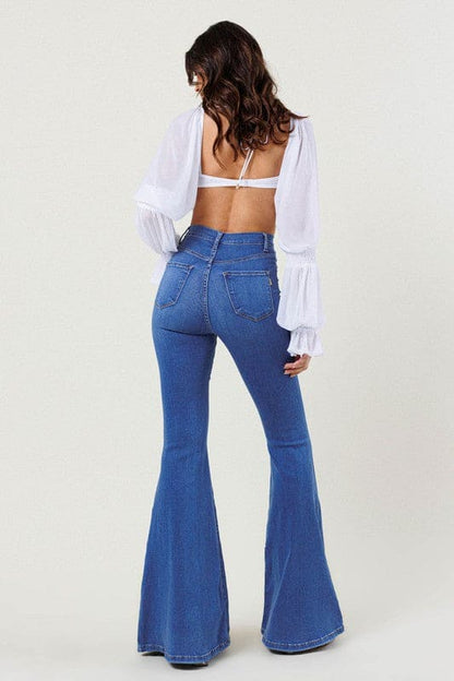 High-Rise Distressed Flare Jeans Medium Stone Flare Jeans by Vibrant M.i.U | Fleurcouture