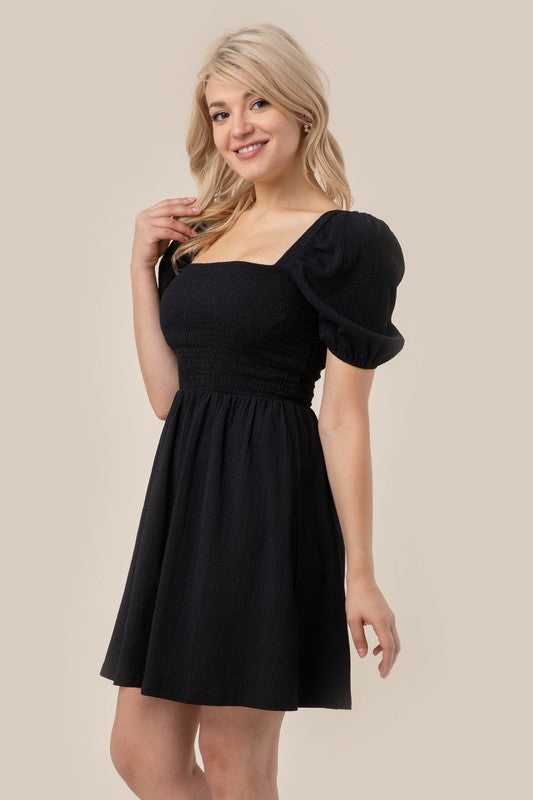 Puff sleeved smocked dress Black S by Lilou | Fleurcouture