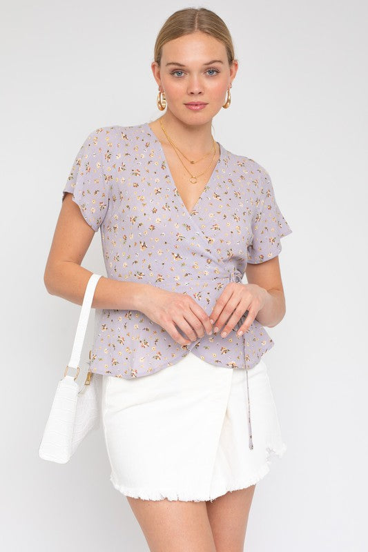 S/S Wrap W/Self Waist Tie Ditsy Print Top LAVENDER-WHT DITSY by Gilli | Fleurcouture