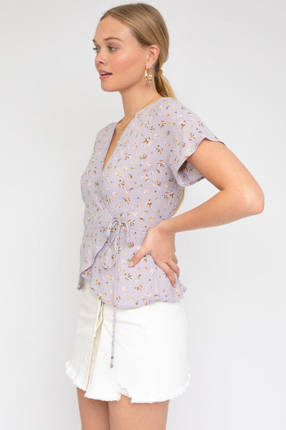 S/S Wrap W/Self Waist Tie Ditsy Print Top LAVENDER-WHT DITSY by Gilli | Fleurcouture