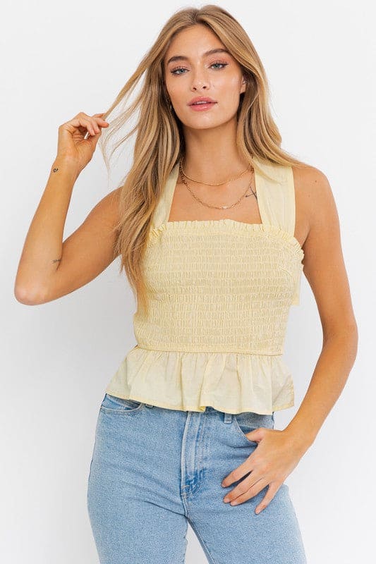 Sleeveless Smocked Peplum Top LEMON S by LE LIS | Fleurcouture