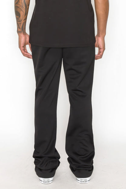 Solid Flare Stacked Track Pants by Fleurcouture | Fleurcouture