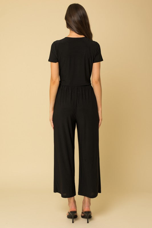 Solid Surplice Cropped Jumpsuit with Faux Wrap Black by Gilli | Fleurcouture