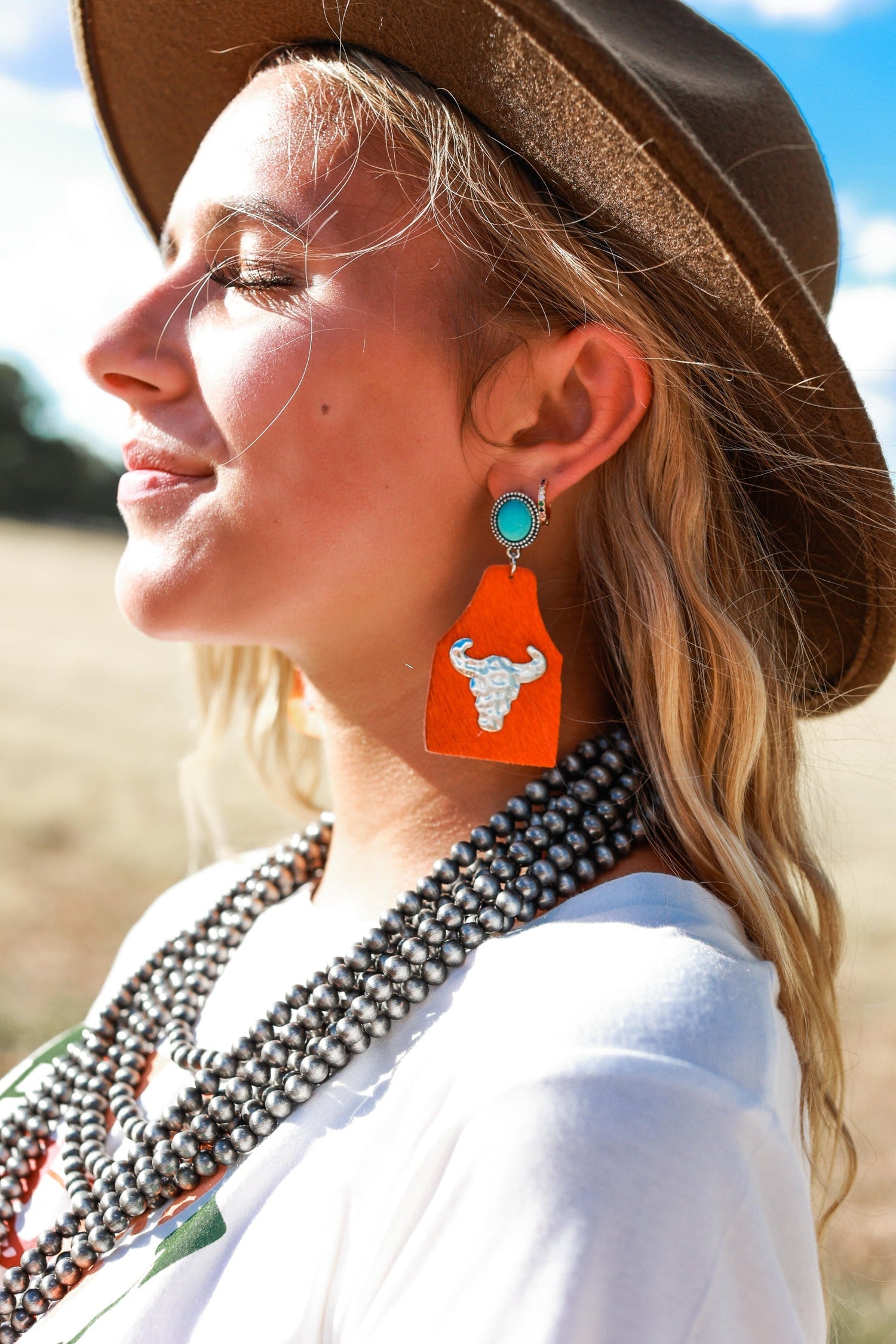 Take A Number Cowboy Orange Cowhide Copper Cow Skull Stud Earrings Orange One Size Earrings by Ashlyn Rose | Fleurcouture