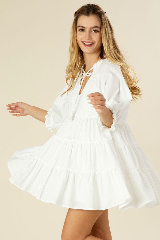 Tiered mini dress with tassel Off white by Lilou | Fleurcouture